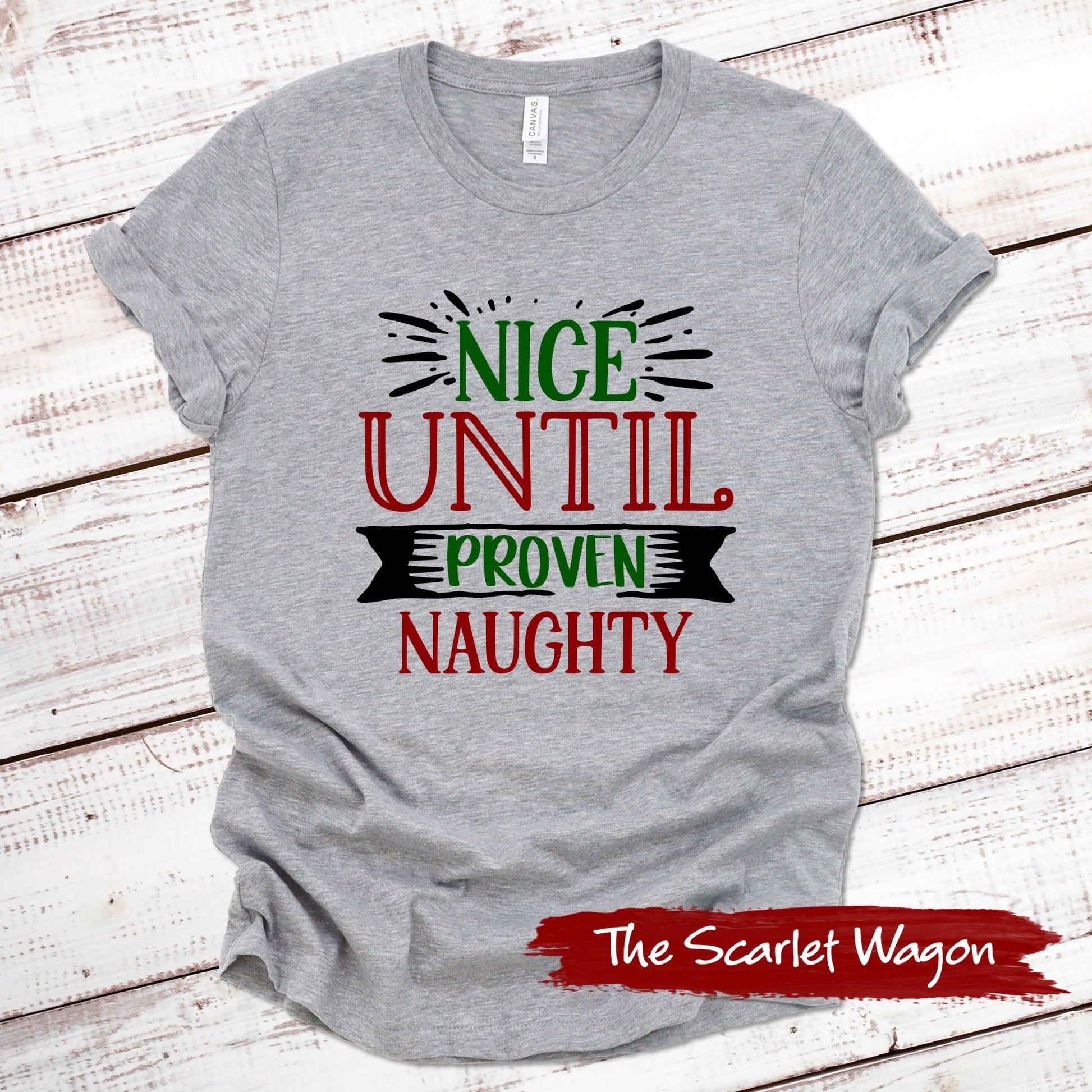 Nice Until Proven Naughty Christmas Shirt Scarlet Wagon Athletic Heather XS 