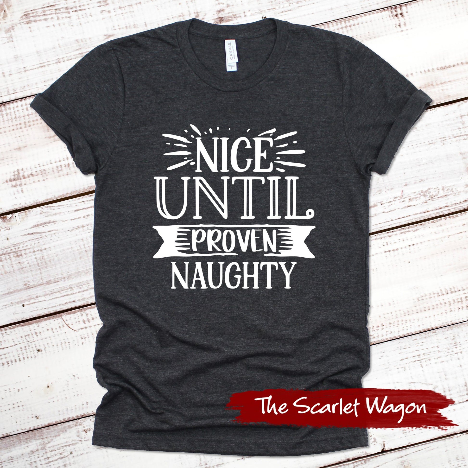 Nice Until Proven Naughty Christmas Shirt Scarlet Wagon Dark Gray Heather XS 